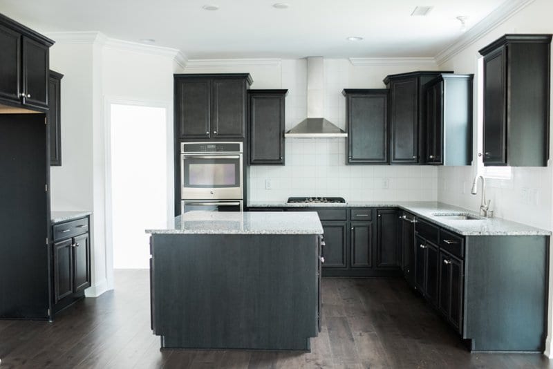 Black cabinets with granite counters