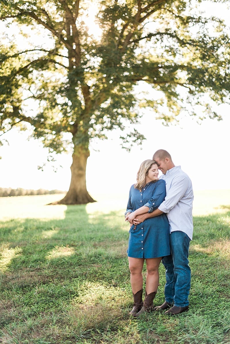 summerfield farms engagement pictures in a field