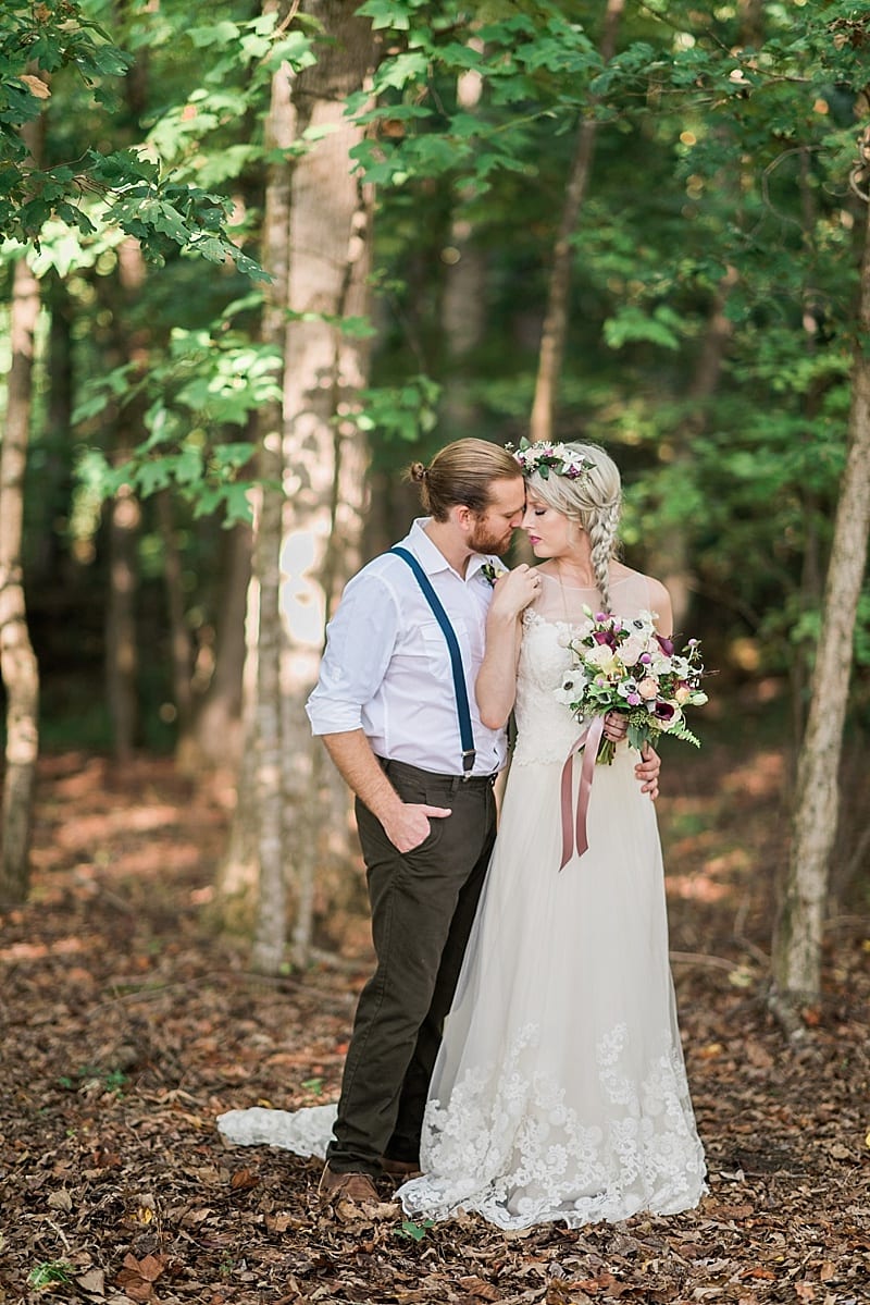 fairy like bride & groom in the woods photo
