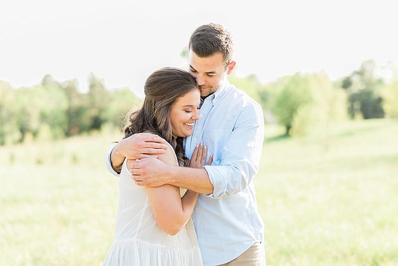 wake forest nc engagement couple snuggling photo