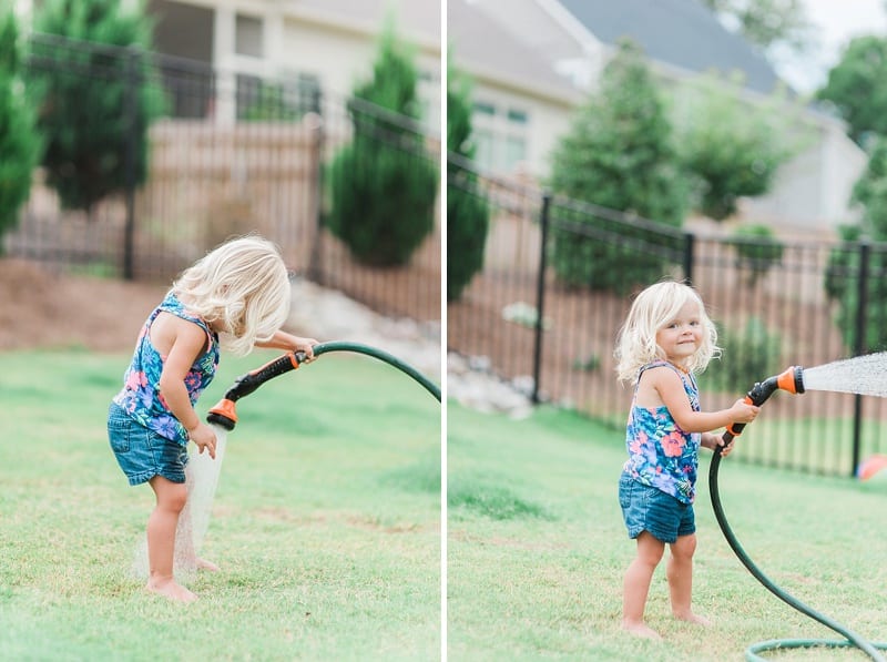 wake forest nc toddler playing with the water hose photo