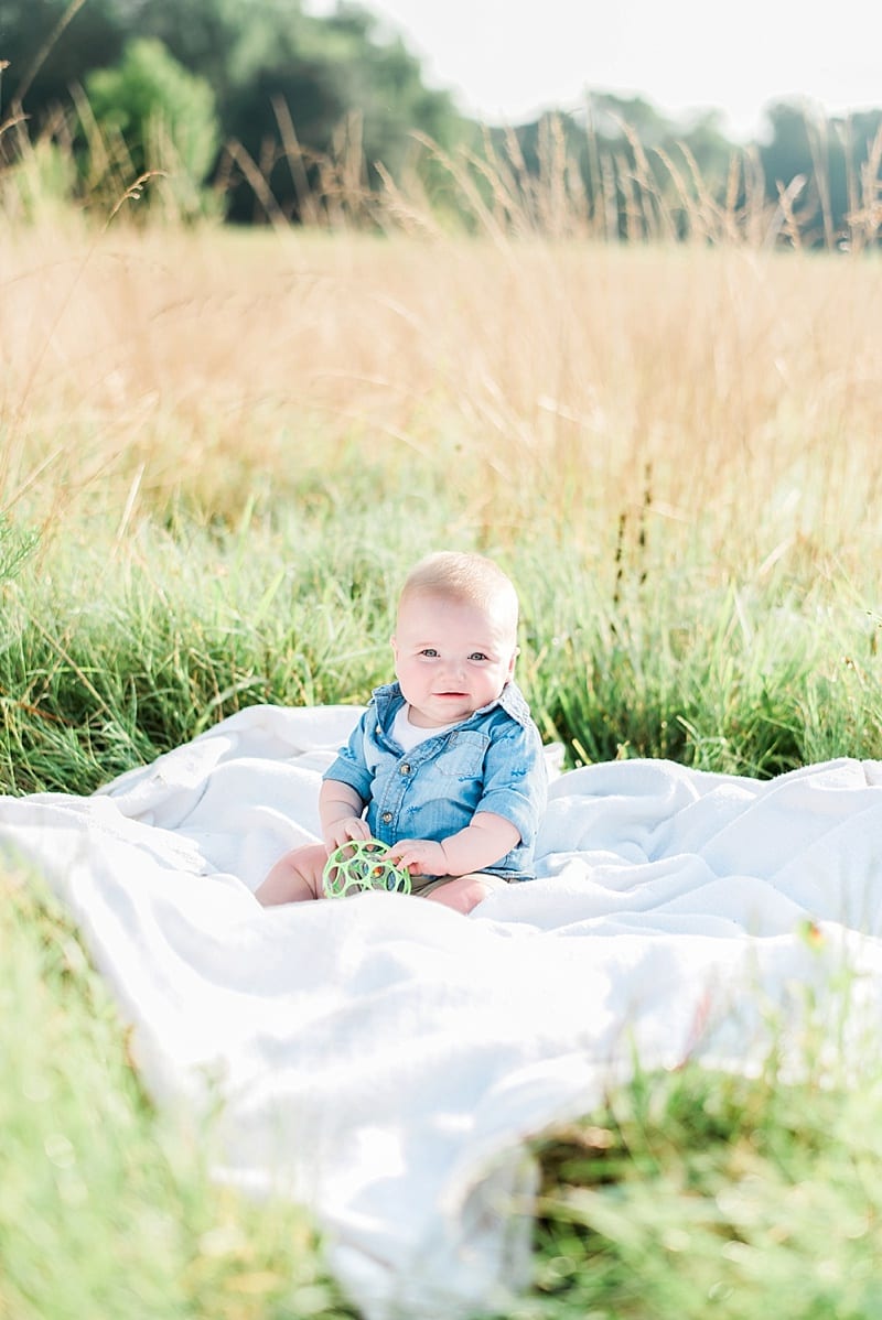 baby in a field photo