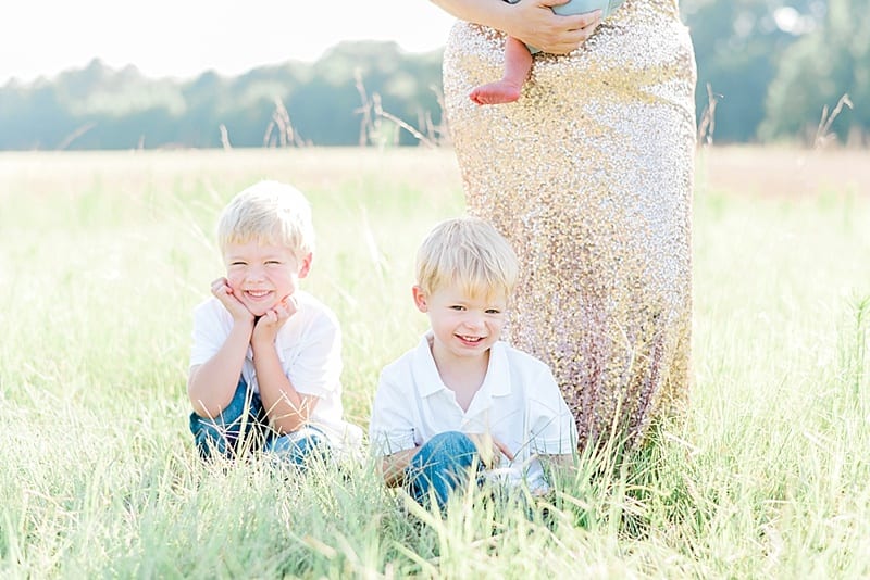 nc motherhood session in a gold sequin gown in a field photo