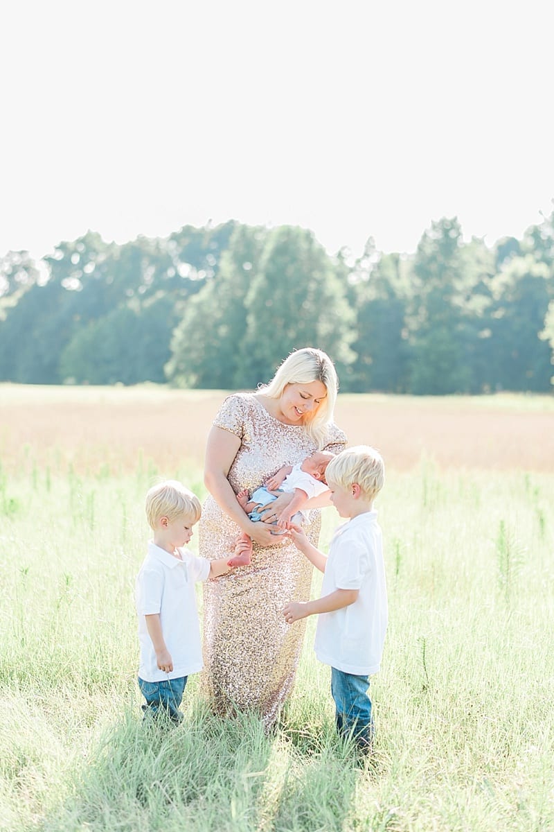 fine art motherhood session in a gold sequin gown photo