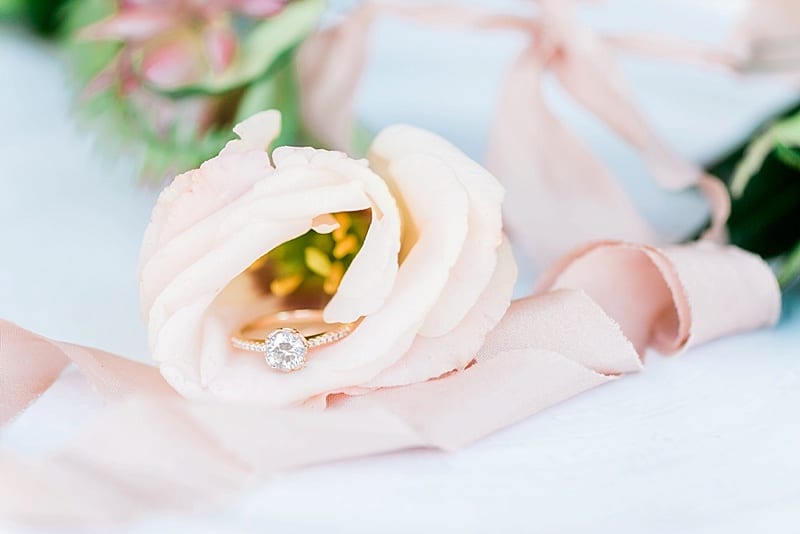 gold round diamond engagement ring in pink rose photo