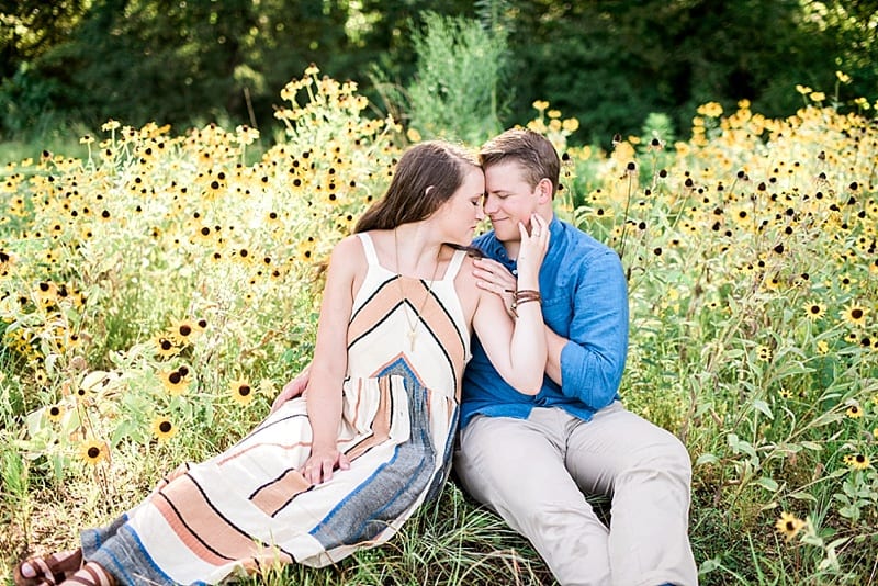 engagement photos in a field of wildflowers photo