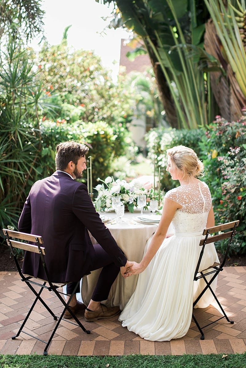 bride and groom in a florida garden photo