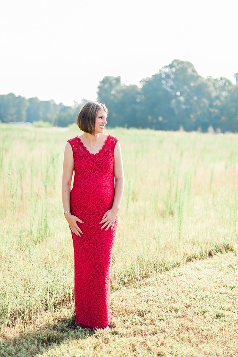 maternity portraits in a red ballgown photo