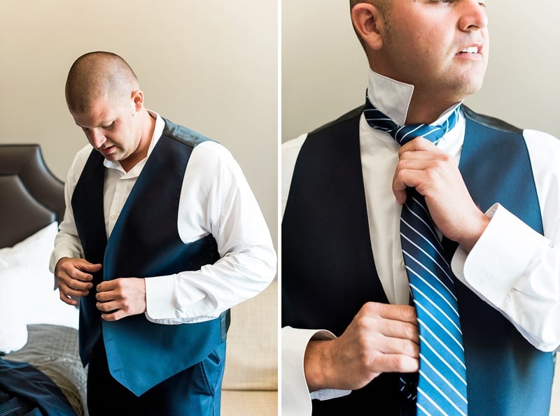 groom tieing tie photo