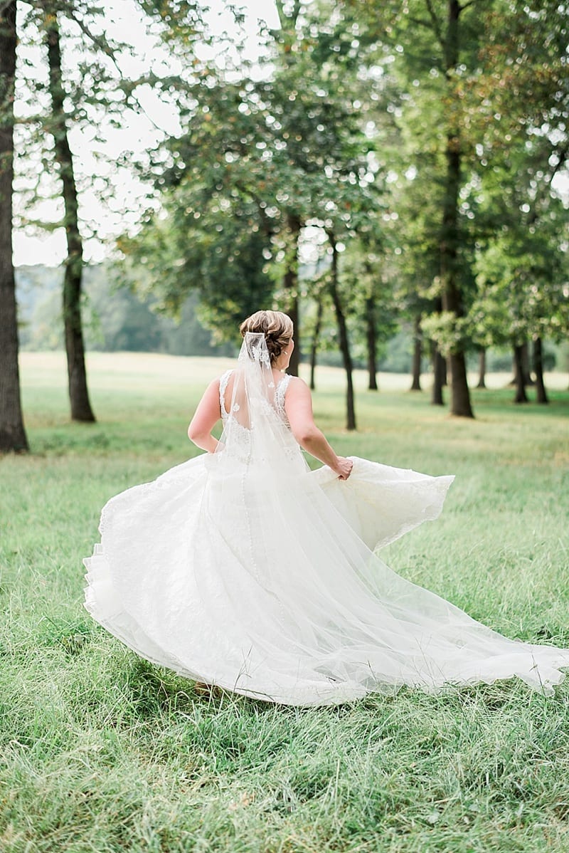 summerfield farms bride twirling barefoot in the woods photo