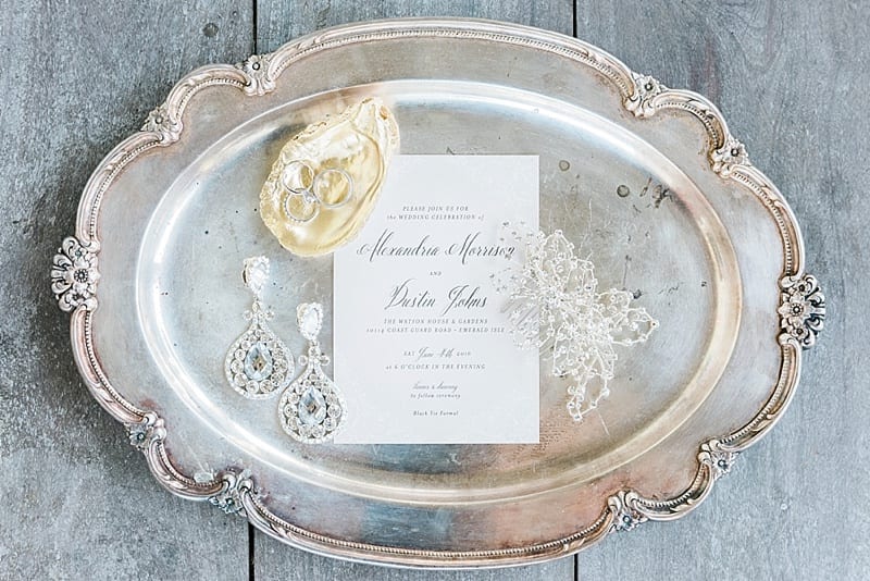 invitation suite on a silver platter with gold details photo