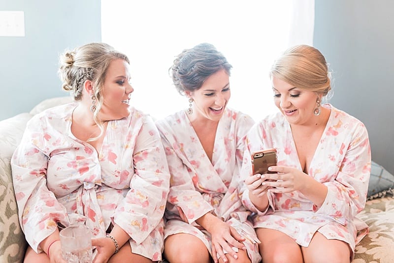 bridesmaids in matching floral robes photo
