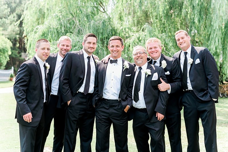 emerald isle wedding groomsmen black tie photo