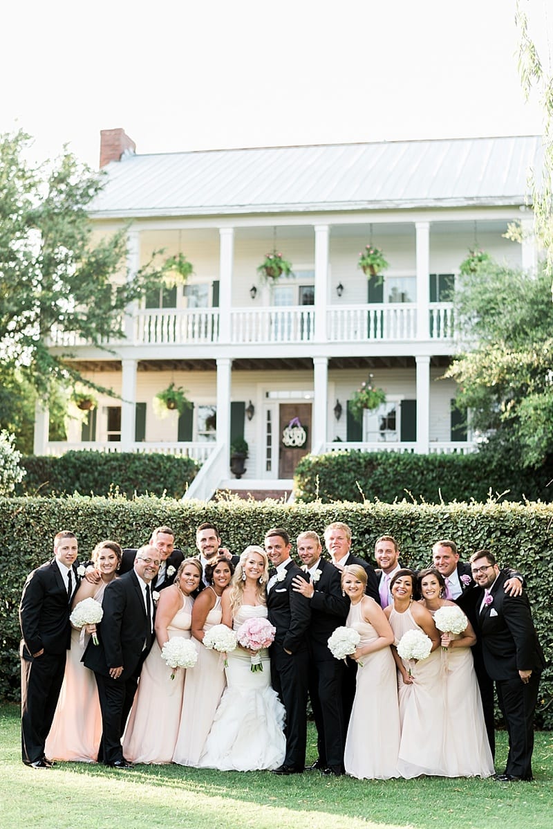 watson house and gardens emerald isle nc wedding party in front lawn photo