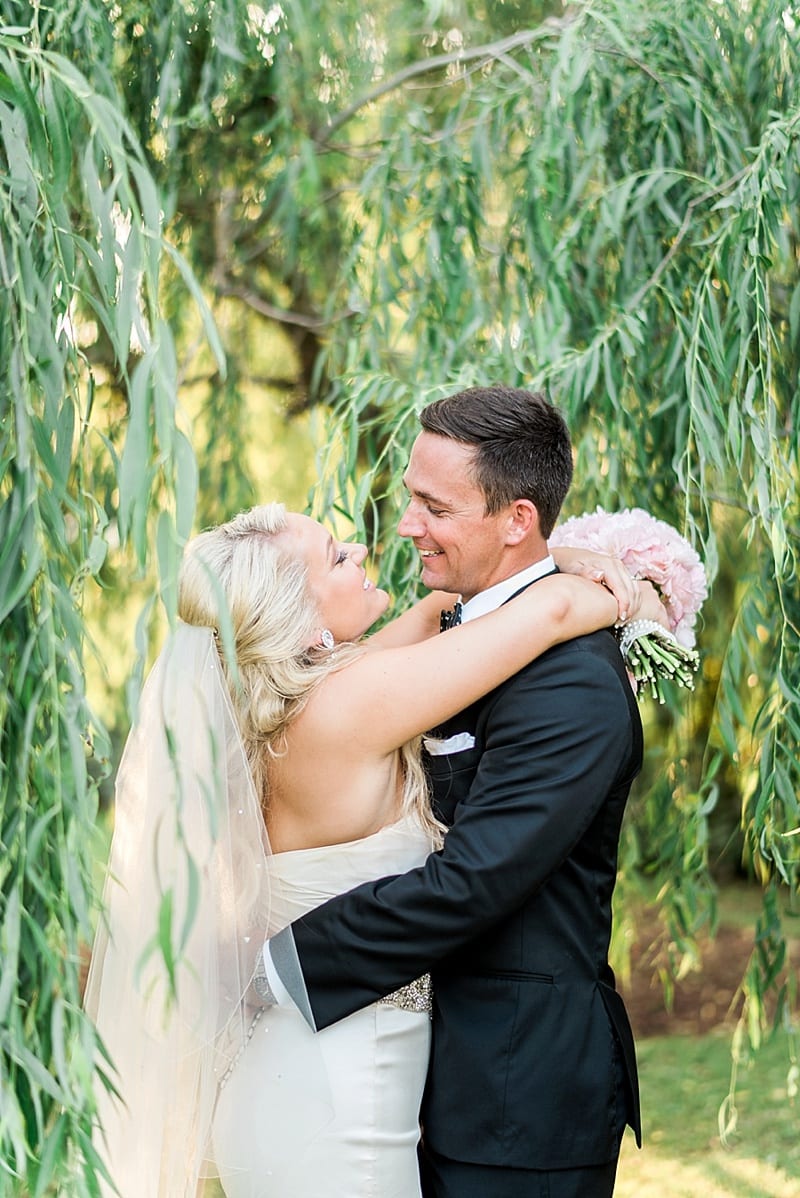 watson house and gardens bride & groom laugh under a willow tree photo