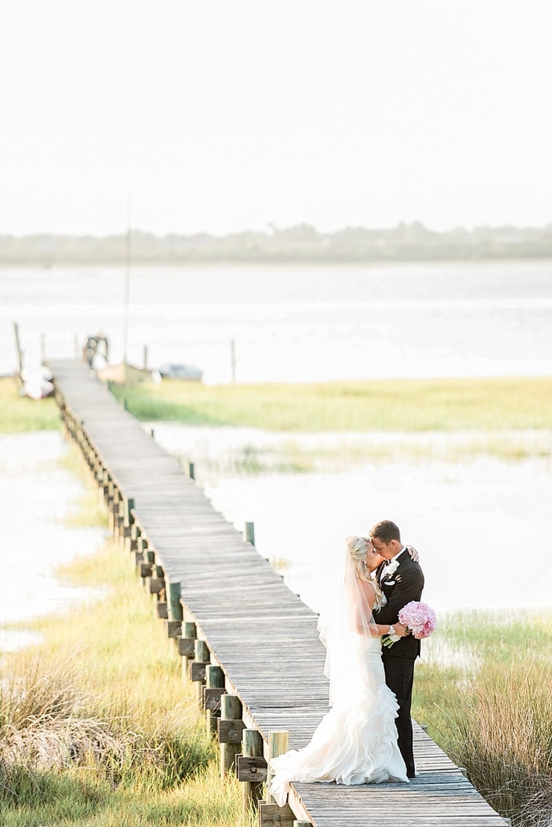 emerald isle nc bride and groom on a dock photo