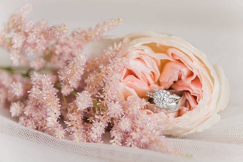 rings in a peony wedding detail photo