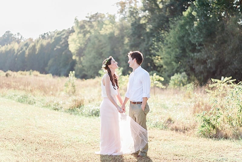 engagement photos with skirt blowing in the wind photo