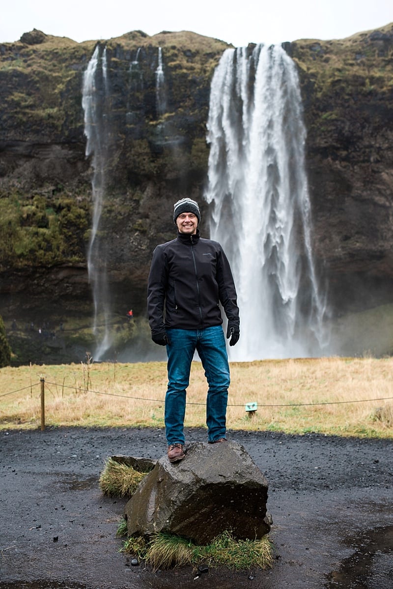 in front of seljalandfoss waterfall iceland photo