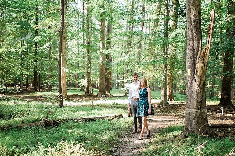 walking through the woods engagement photo