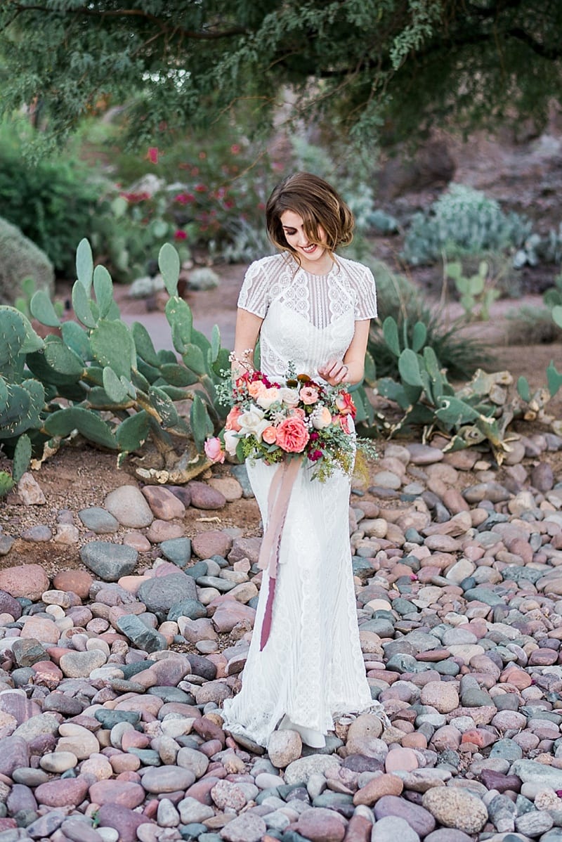 Arizona bride in desert with cactus photo