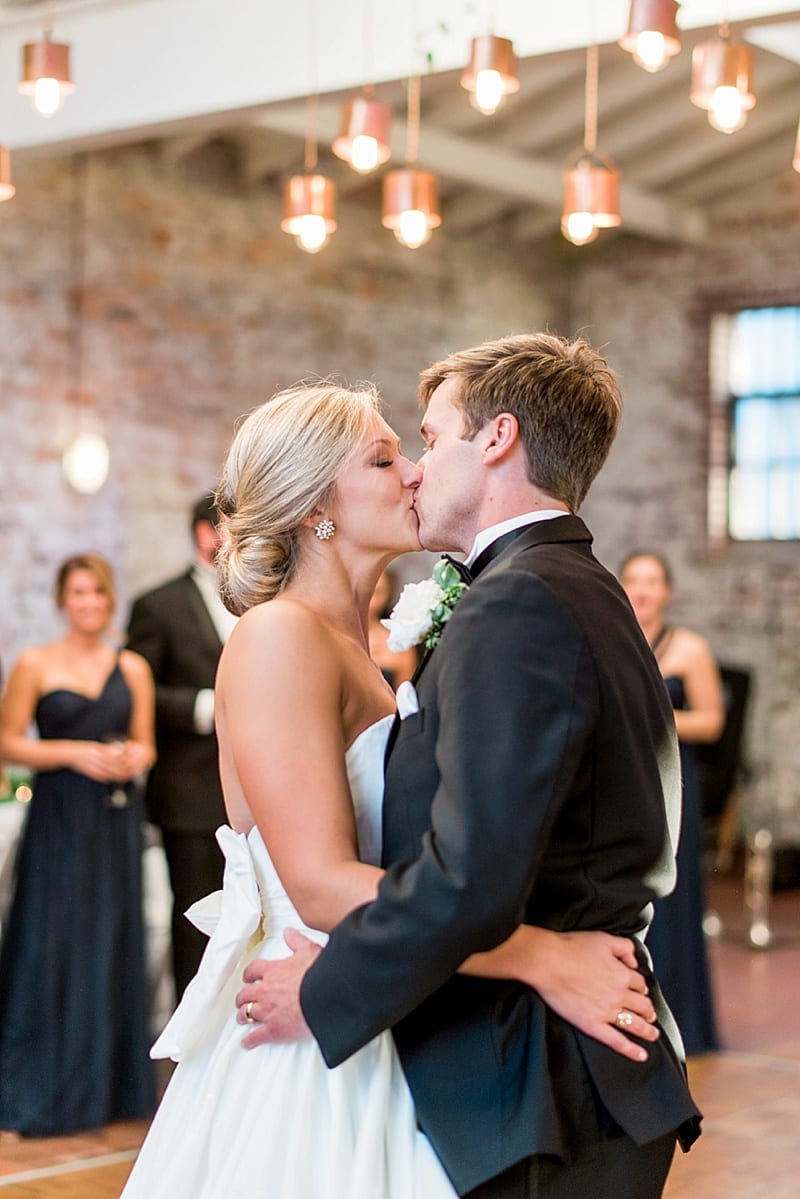 Wilmington wedding bride and groom kiss during reception photo