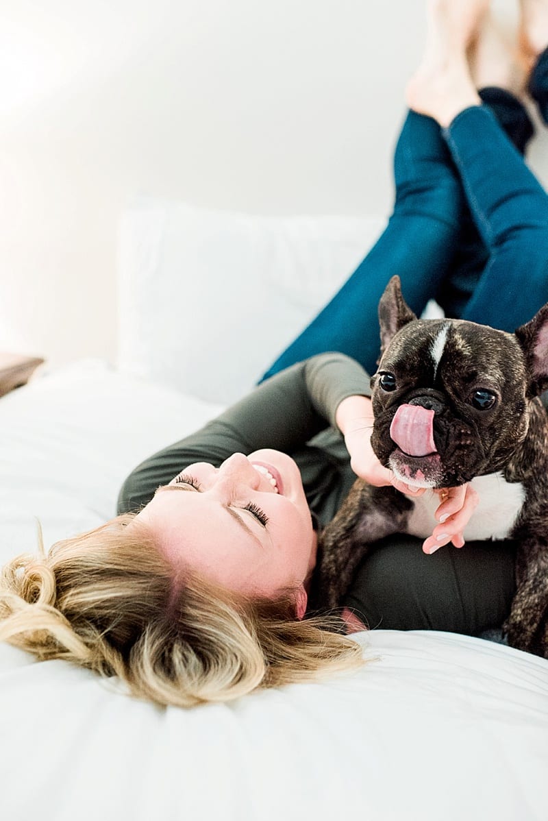 Raleigh indoor lifestyle portraits on bed with dog photo