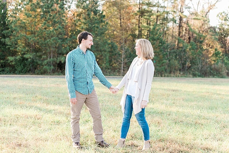 Raleigh holding hands in a field photo