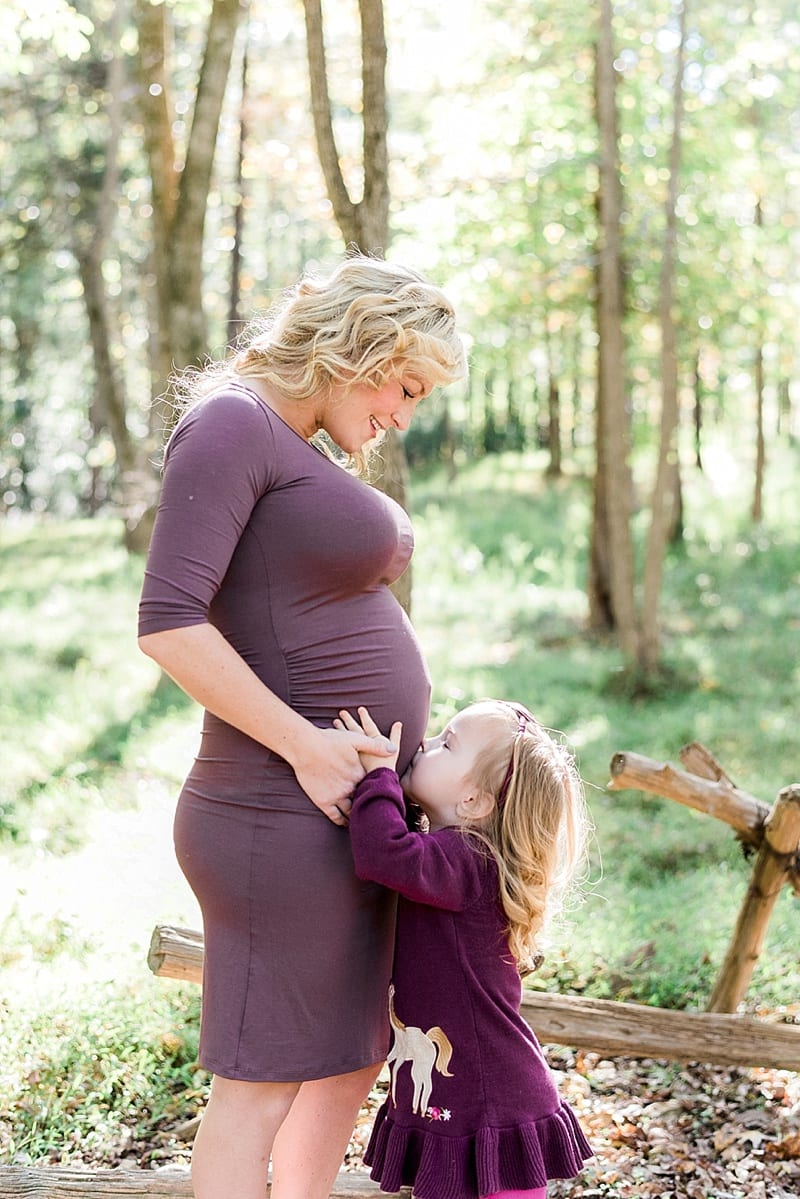 chapel hill big sister kissing mother's belly photo
