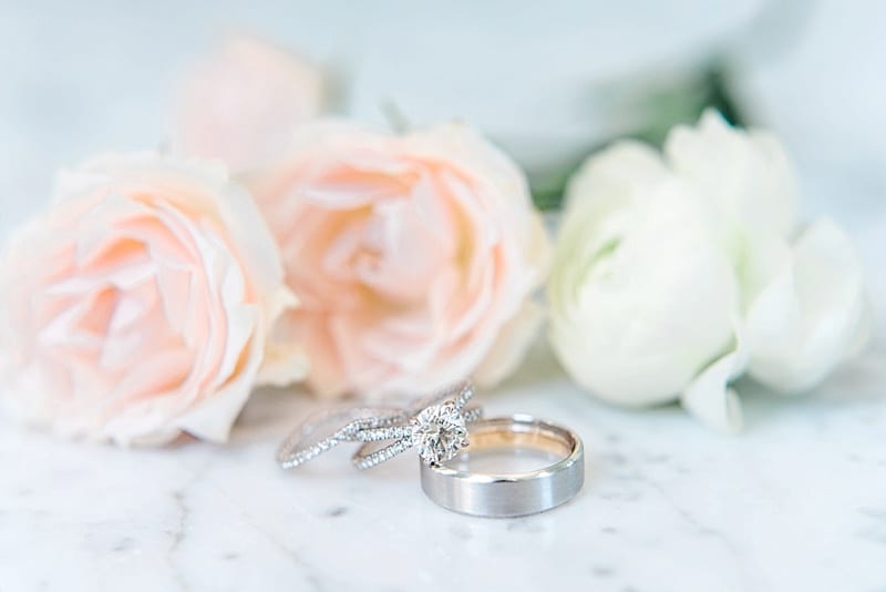 wedding rings with flowers detail photo