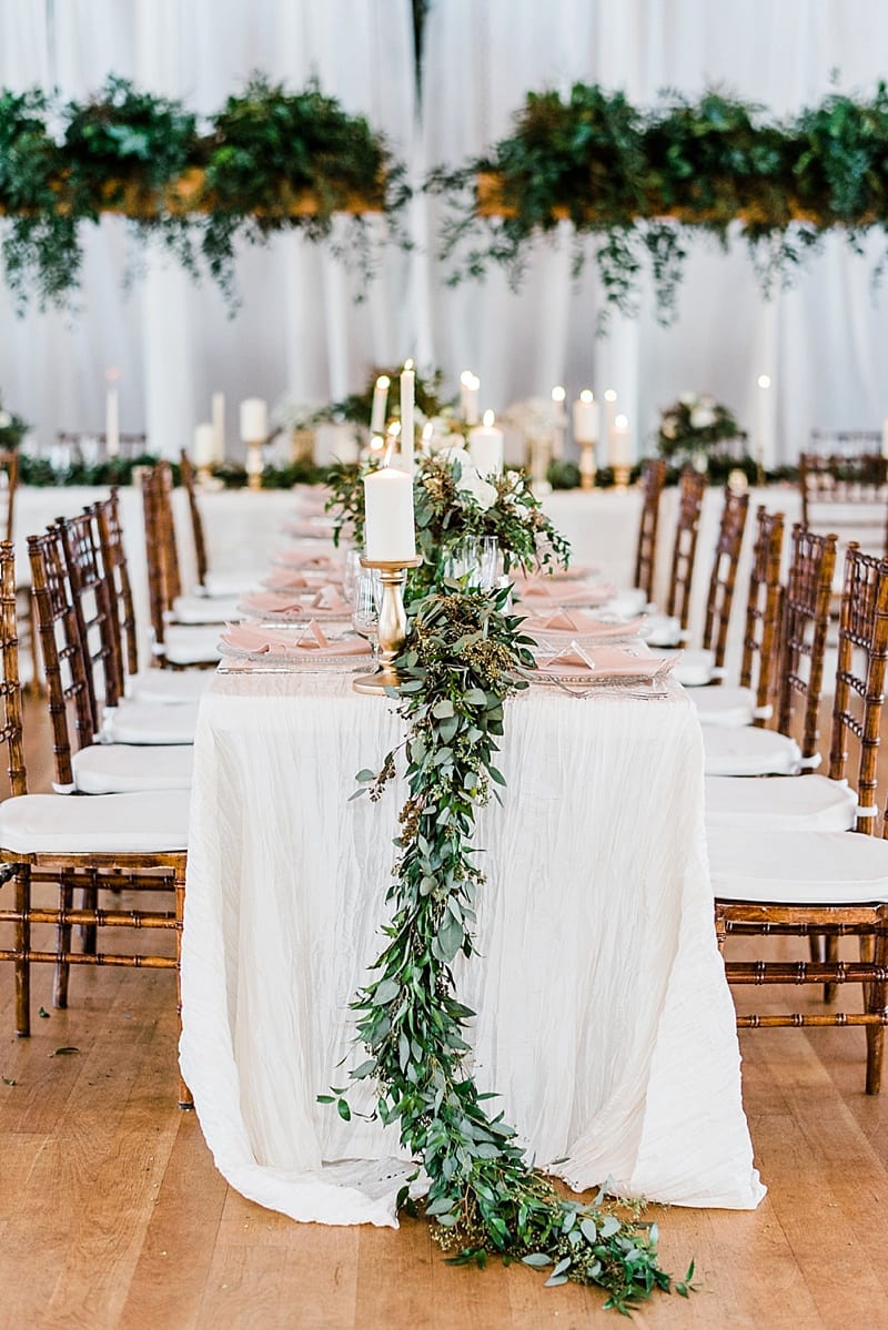 cotton room wedding reception table with greenery photo