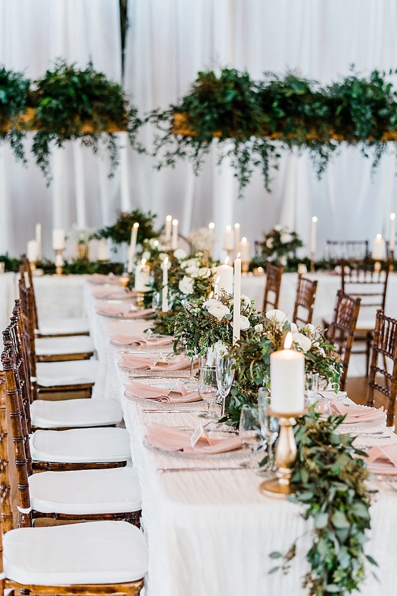 cotton room wedding reception with long tables photo