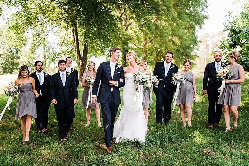 oaks at salem bride and groom walking with bridesmaids and groomsmen photo