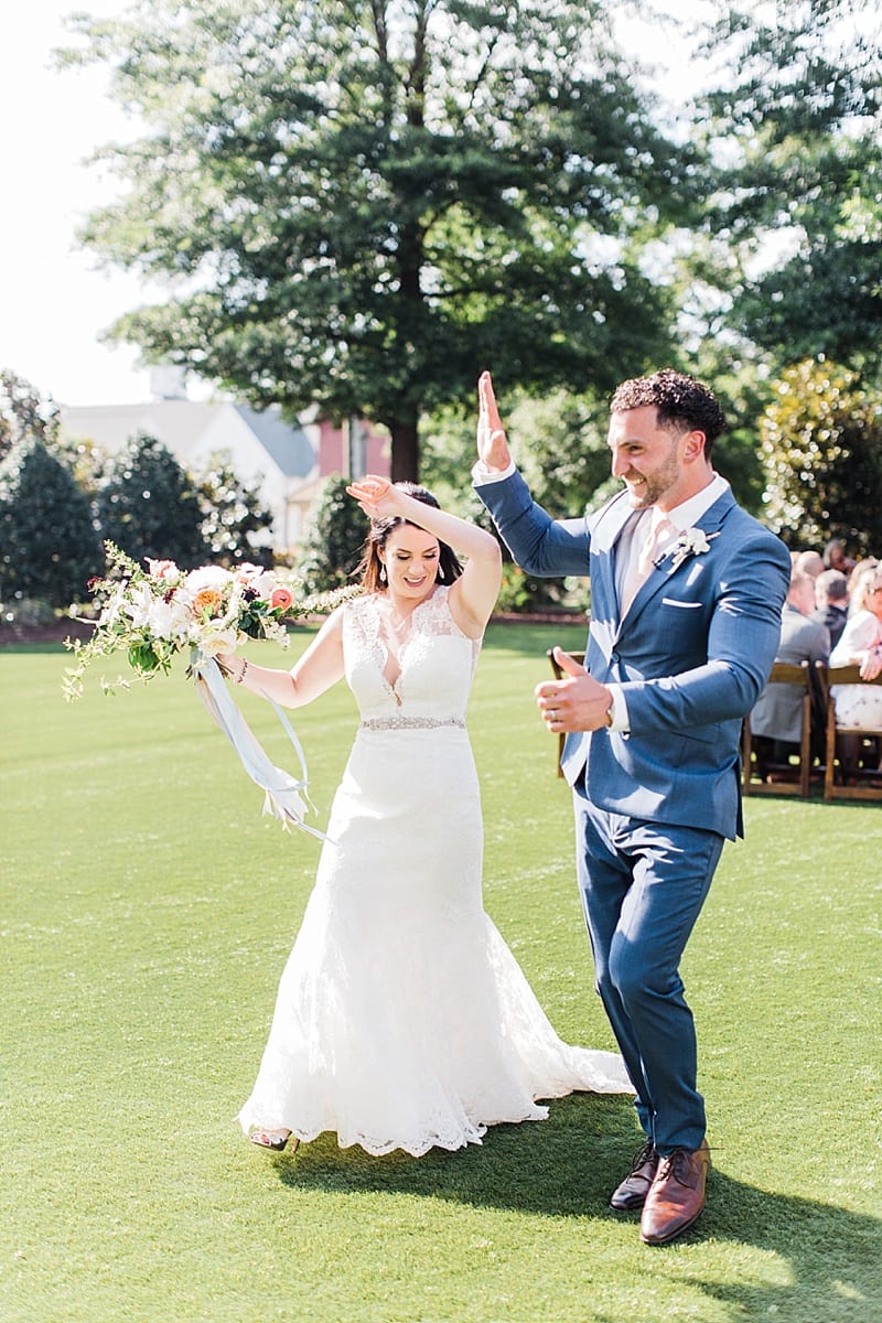 raleigh, nc bride and groom celebrating after ceremony photo