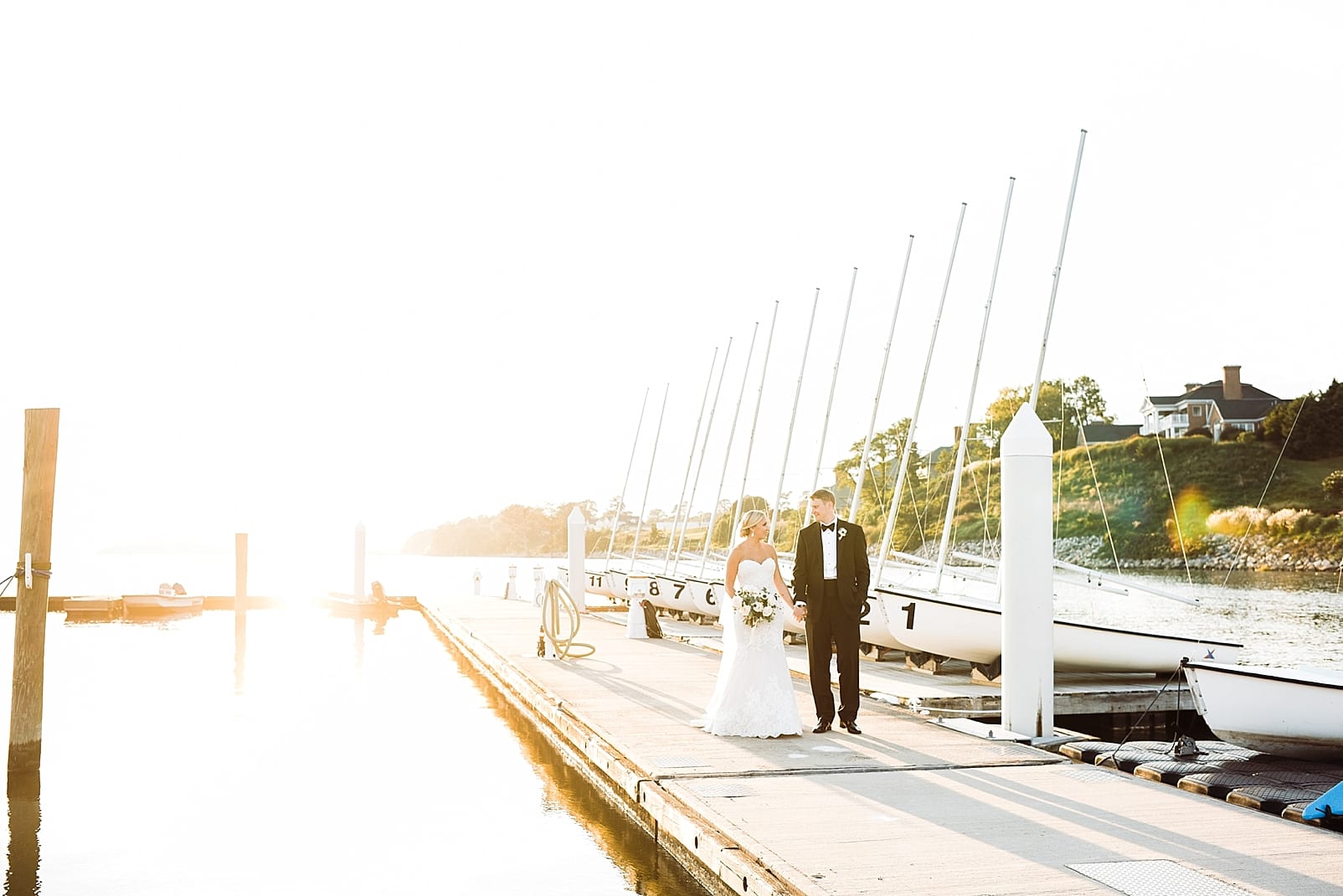 kingsmill resort wedding photographer bride and groom on dock james river sunset photo
