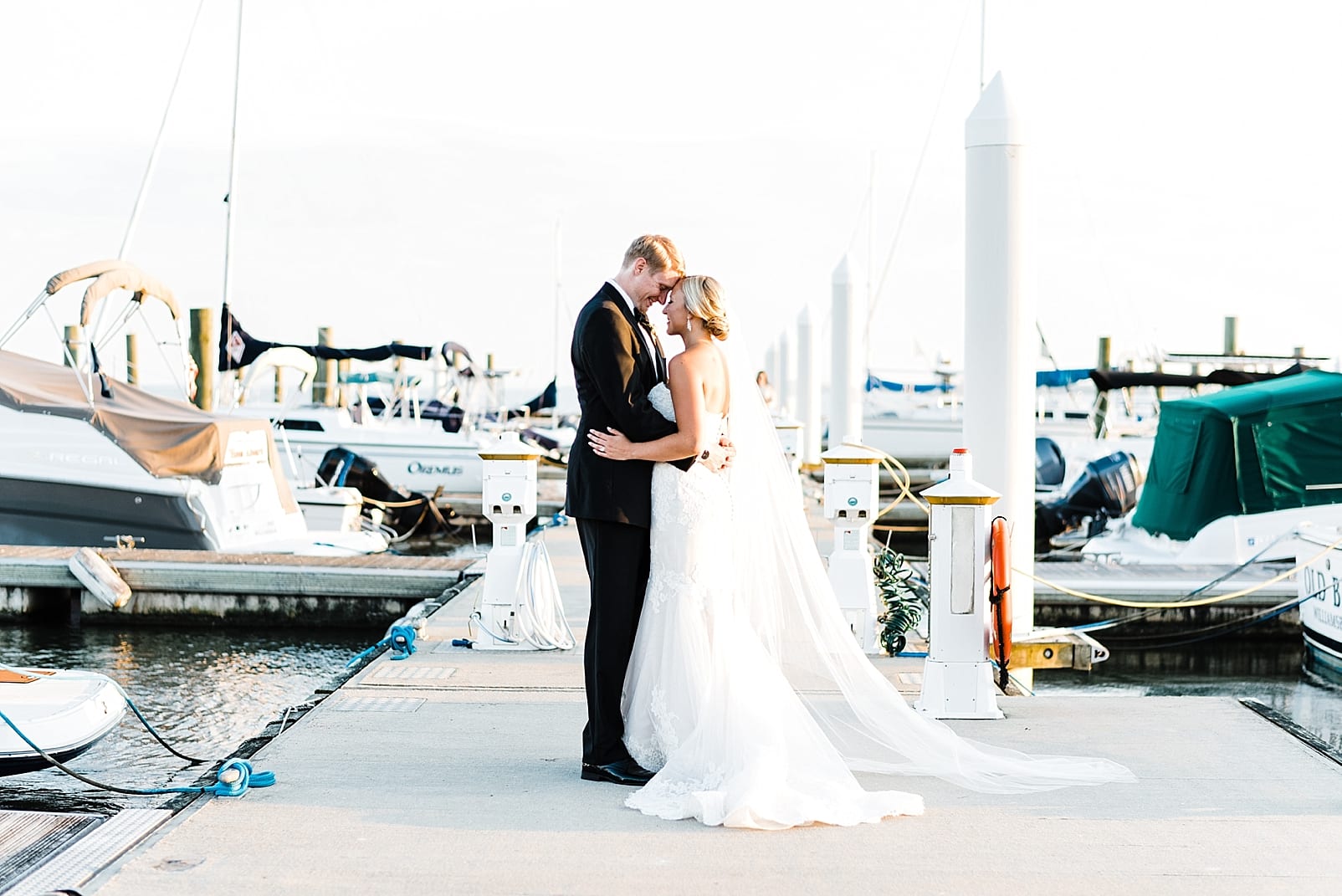 kingsmill resort wedding photographer bride and groom on dock james river wedding photo