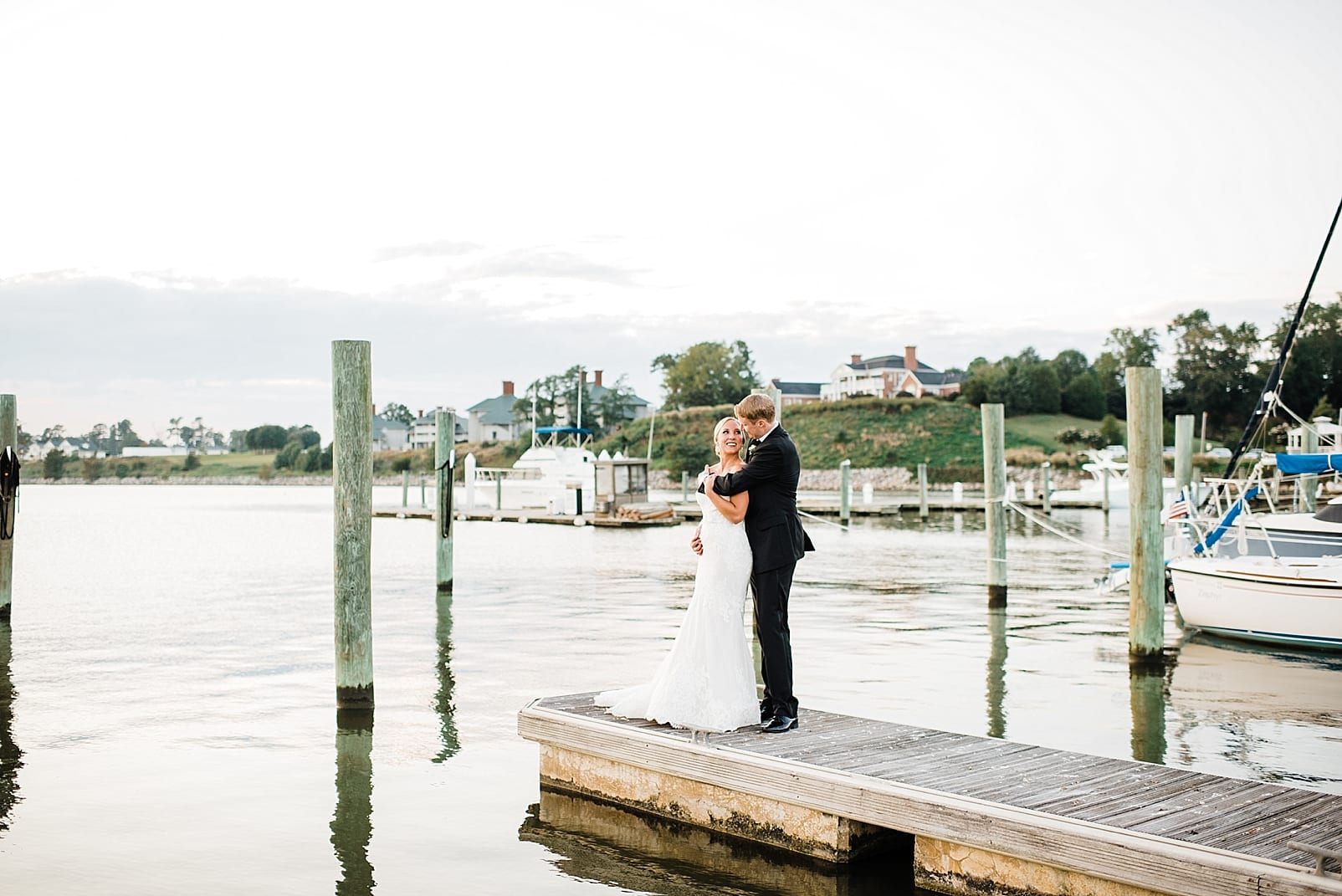 james river wedding photographer bride and groom on dock boats photo
