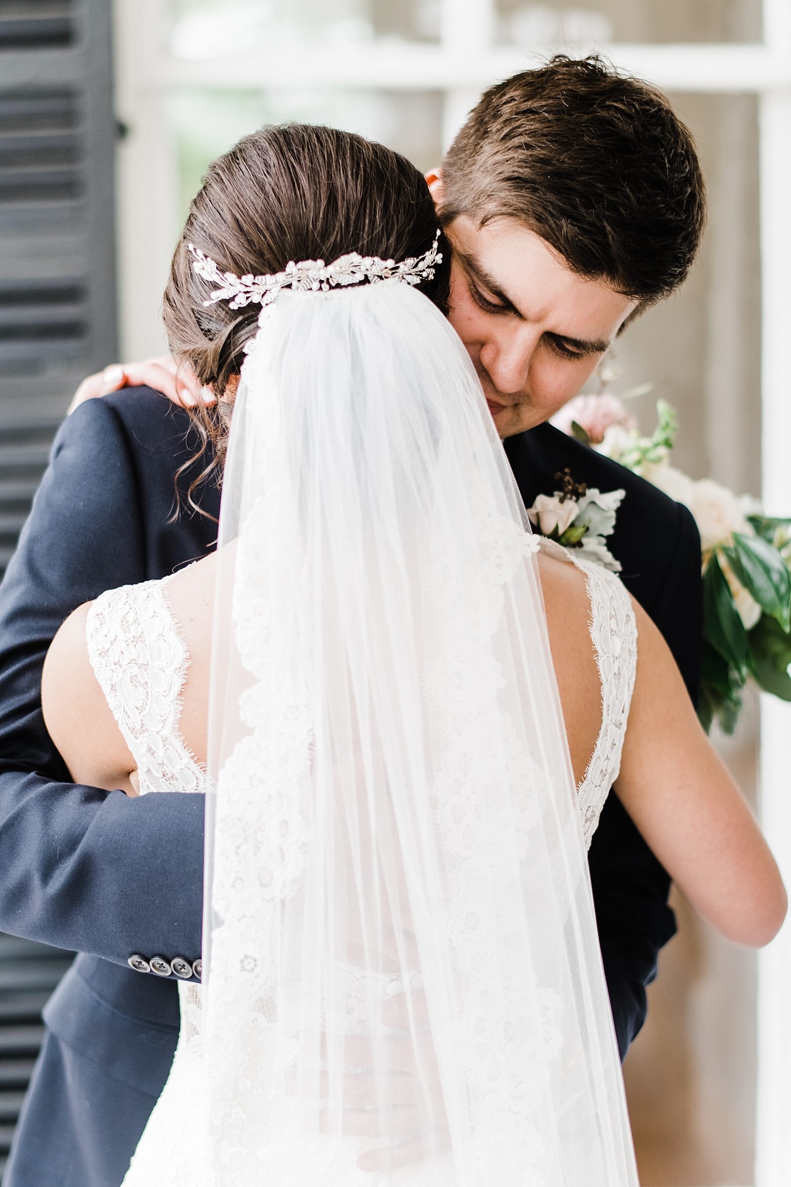 merrimon wynne wedding venue photographer bride and groom first look wedding veil inspiration photo