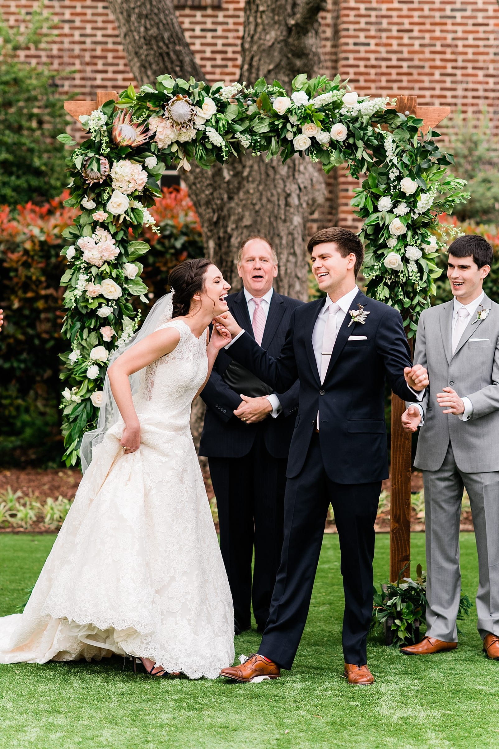 merrimon wynne wedding photographer bushel and peck florist floral arch wedding ceremony photo