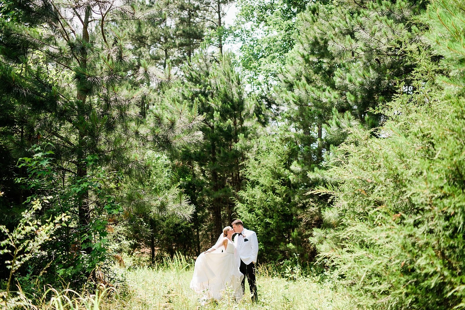 barn at chapel hill bride and groom in a forest photo
