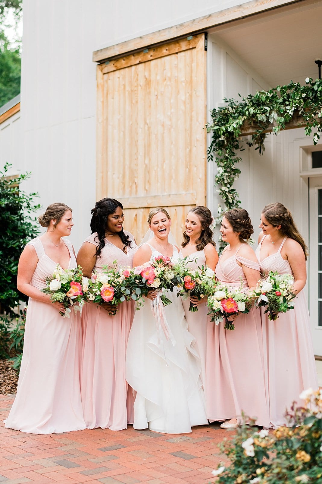 barn at chapel hill bridesmaids in long coral gowns photo