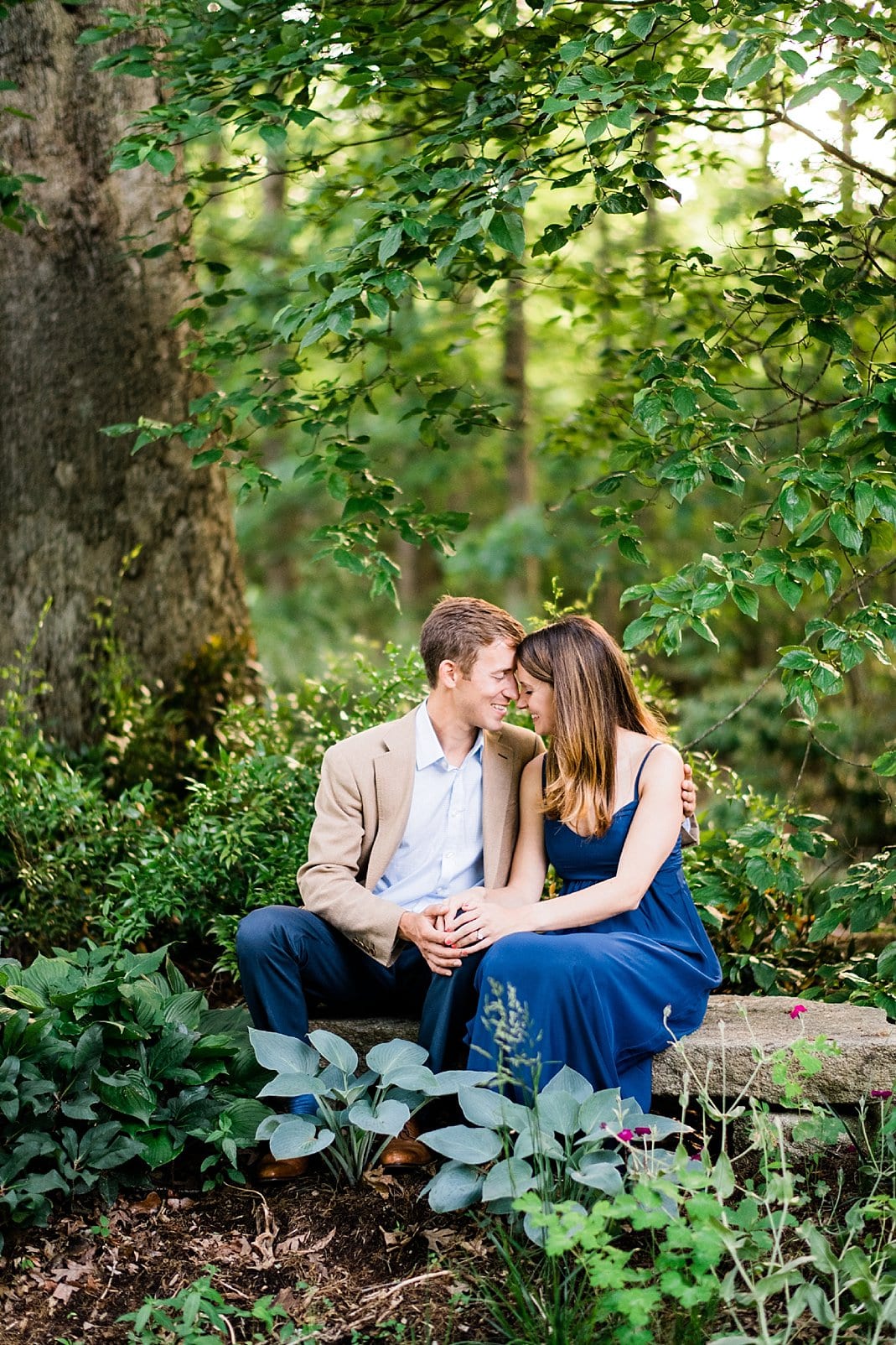 private home engagement session in the woods photo