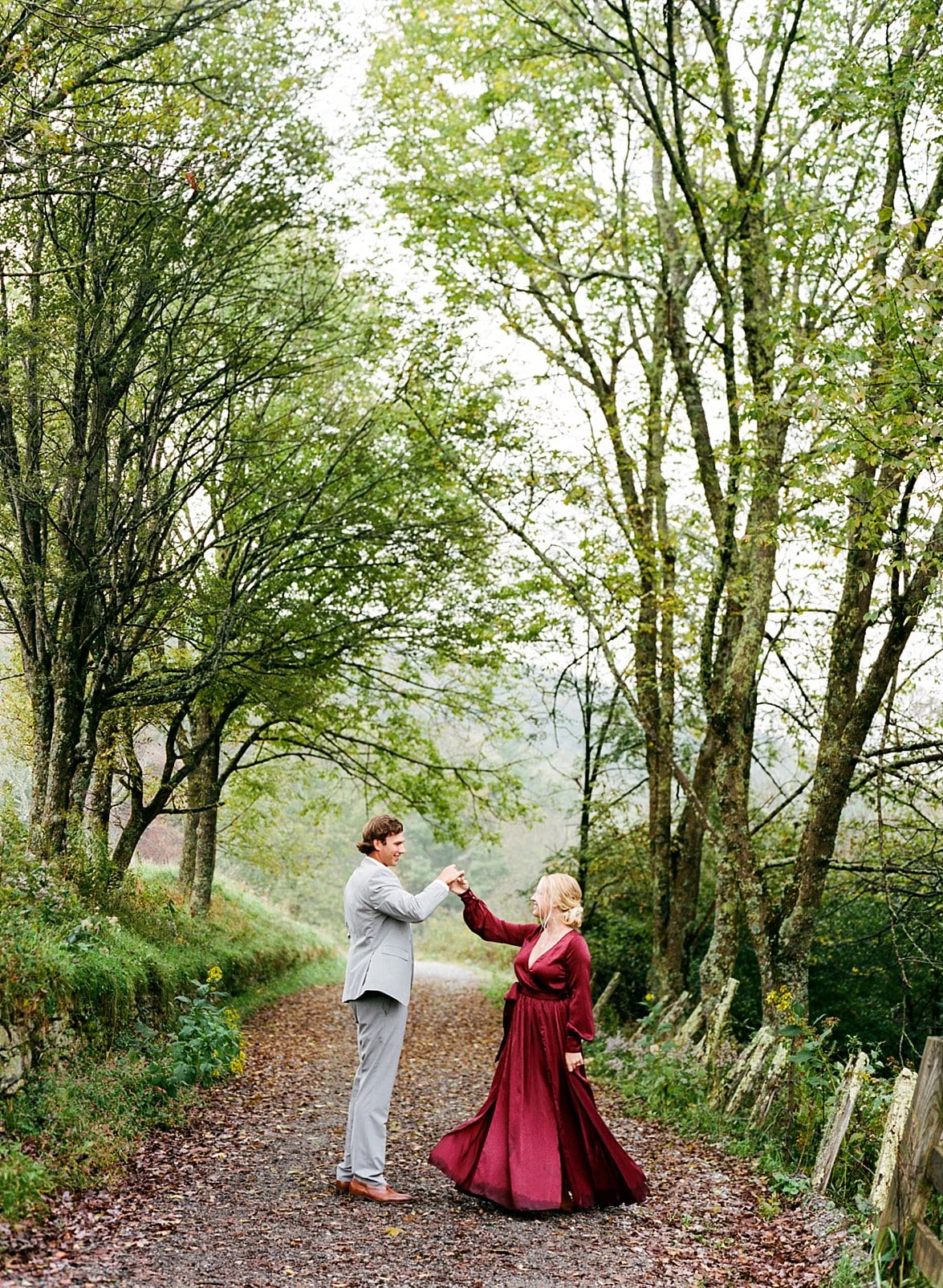 boone engagement session couple dancing in the forest photo