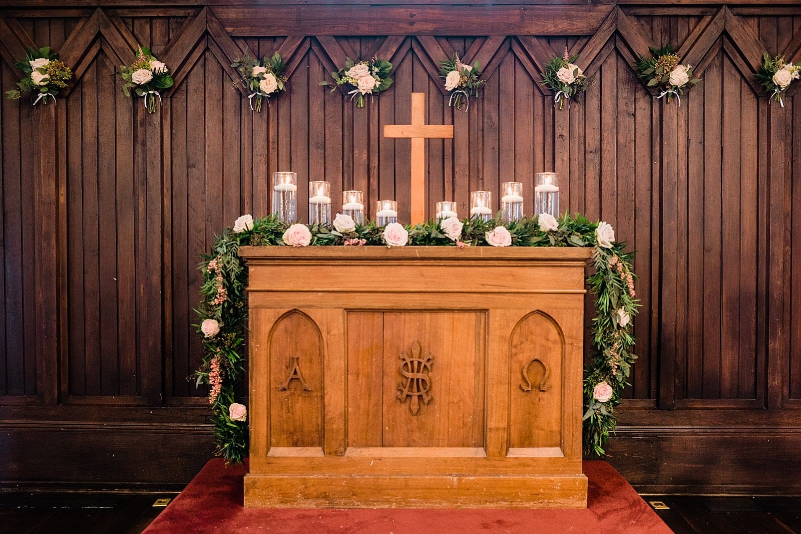 downtown raleigh wedding ceremony altar with greenery draped photo