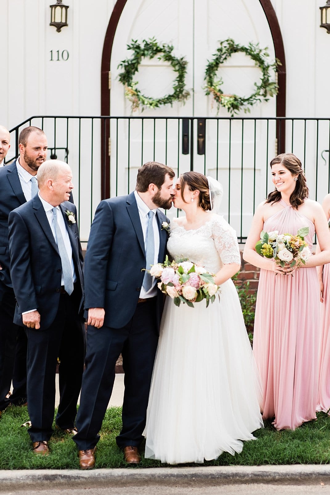 downtown raleigh wedding bride and groom kissing outside photo