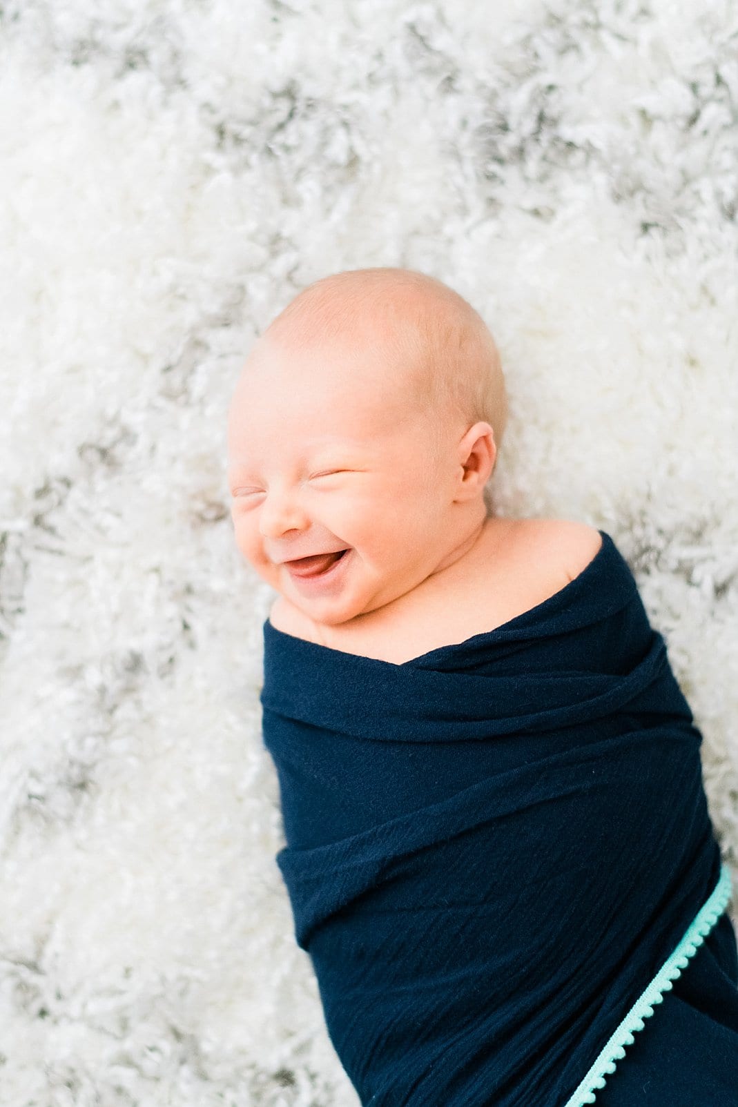 raleigh newborn smiling in his sleep photo
