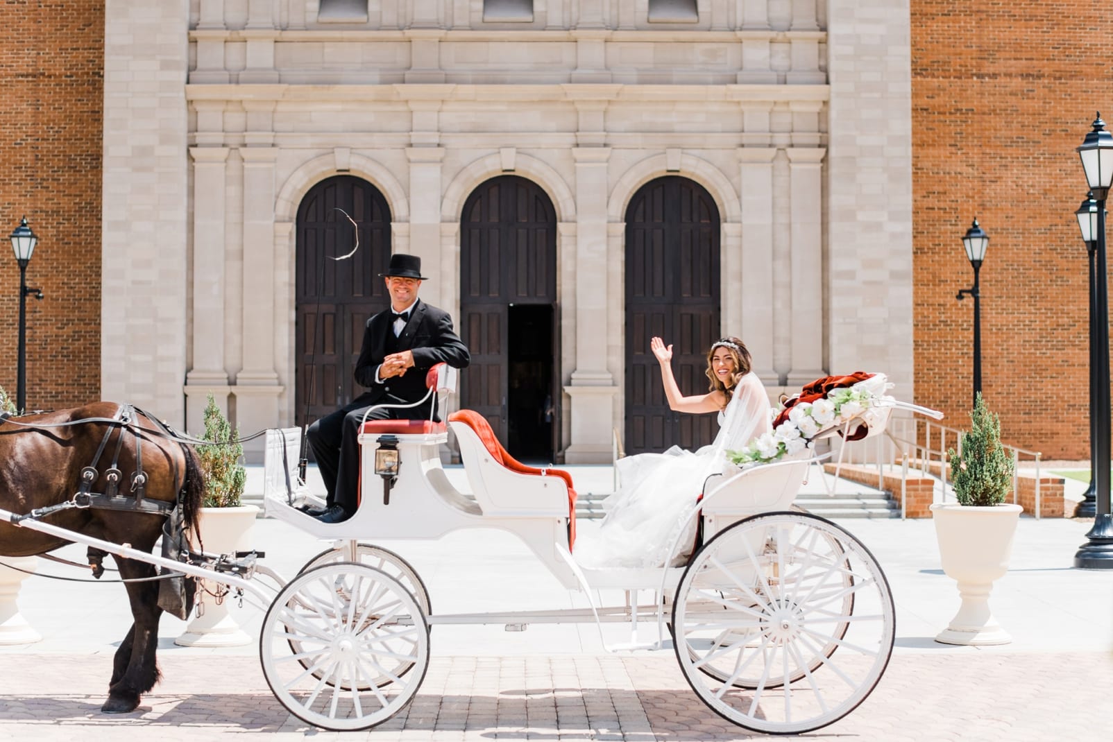 J & L Carriage horse and carriage transporting the bride to the Holy Name of Jesus Cathedral photo
