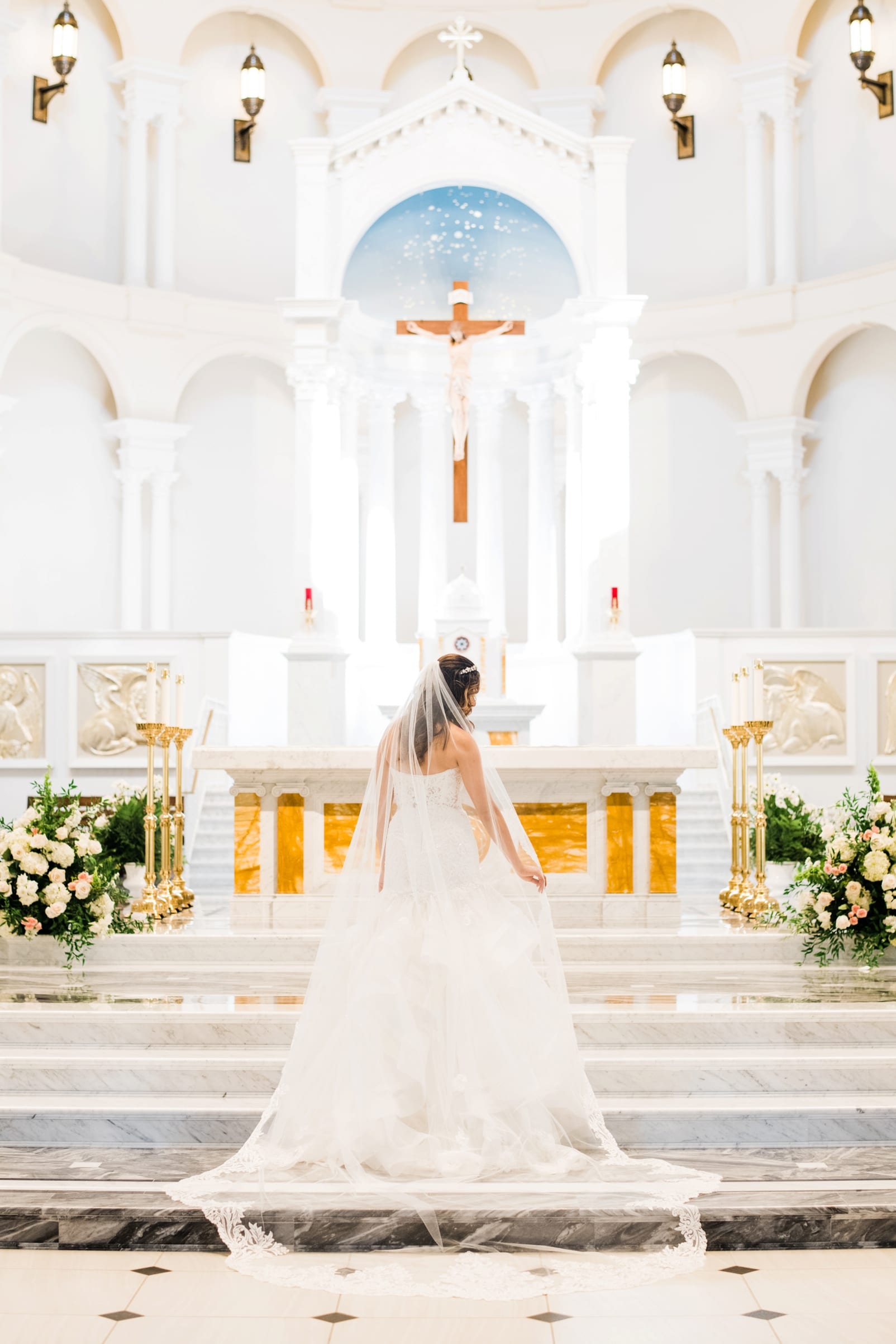 Raleigh, NC bride on Holy Name of Jesus Cathedral sanctuary steps photo