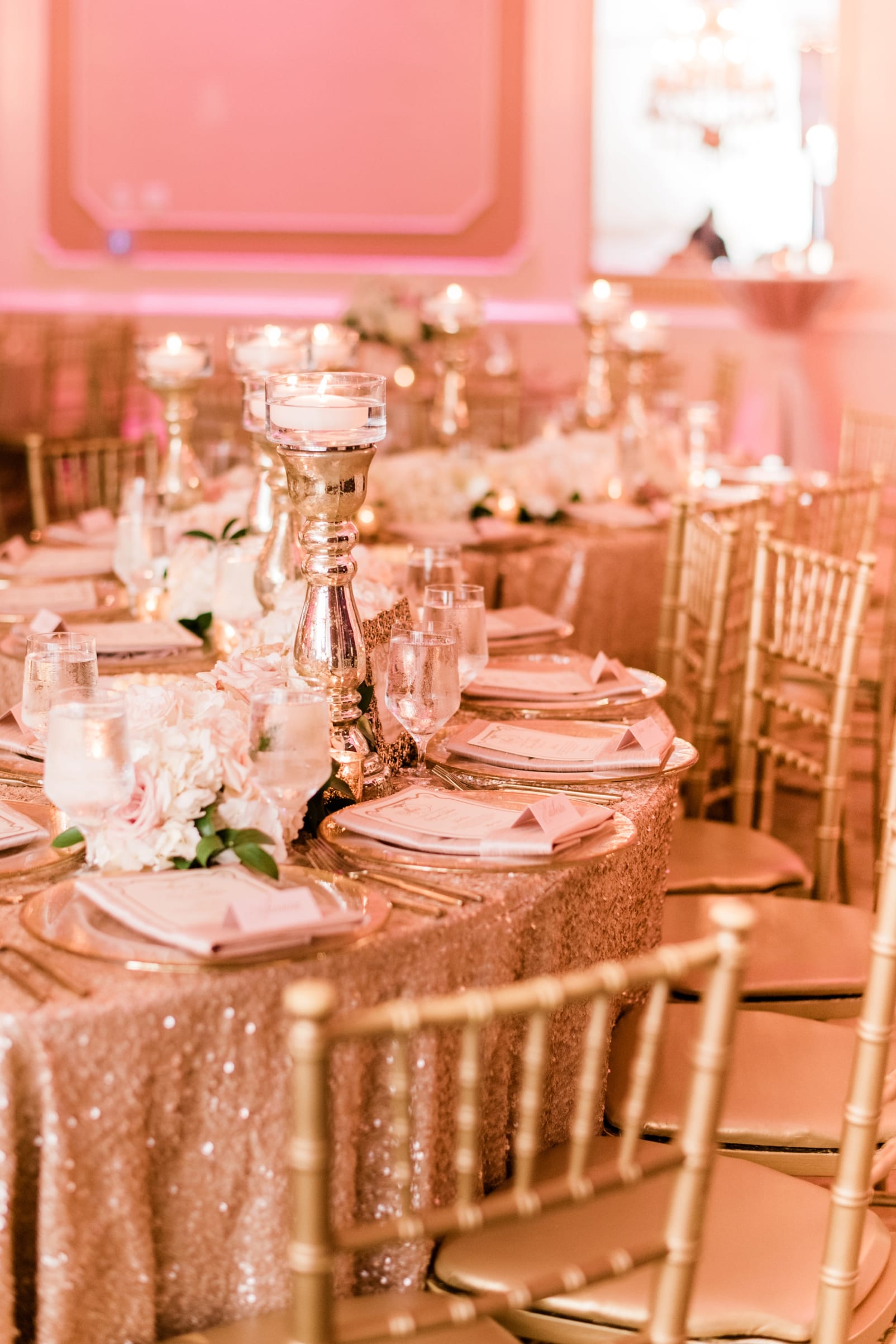 Grand Marquise Ballroom wedding reception round tables with gold chairs and light pink table cloth photo