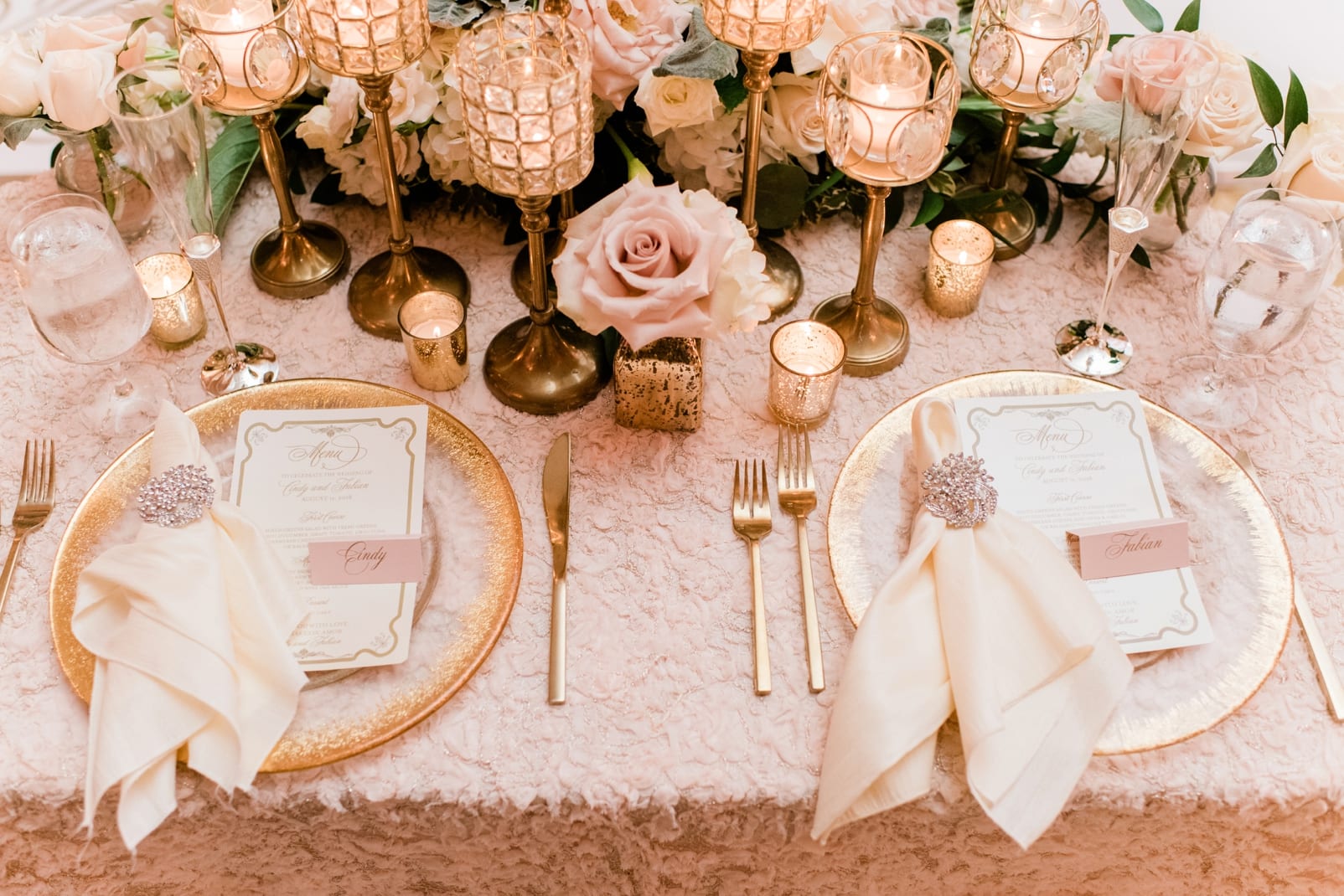 Grand Marquise Ballroom wedding reception table setting with gold rimmed clear chargers and candles photo